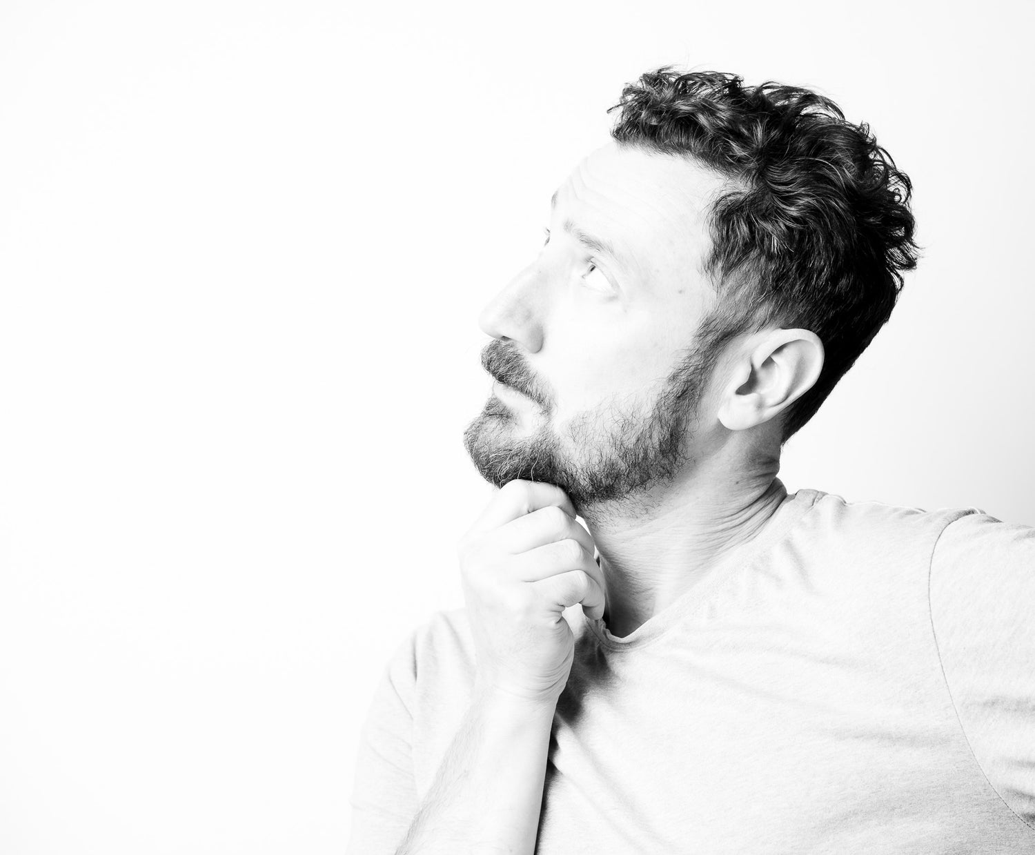 Dr. Fraser GermAnn, PhD anthropologist and Director of Rogue Anthropology, in a high-contrast black and white editorial portrait.